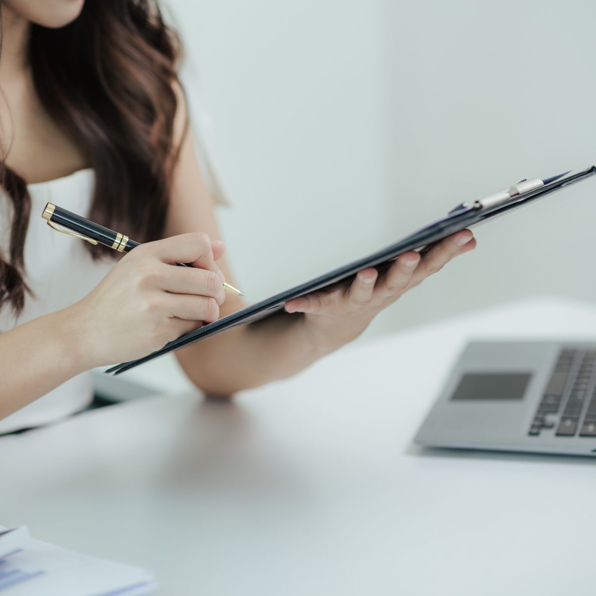 Close-up of Asian businesswoman working at home with laptop in office Financial business startup calculate accounting concept